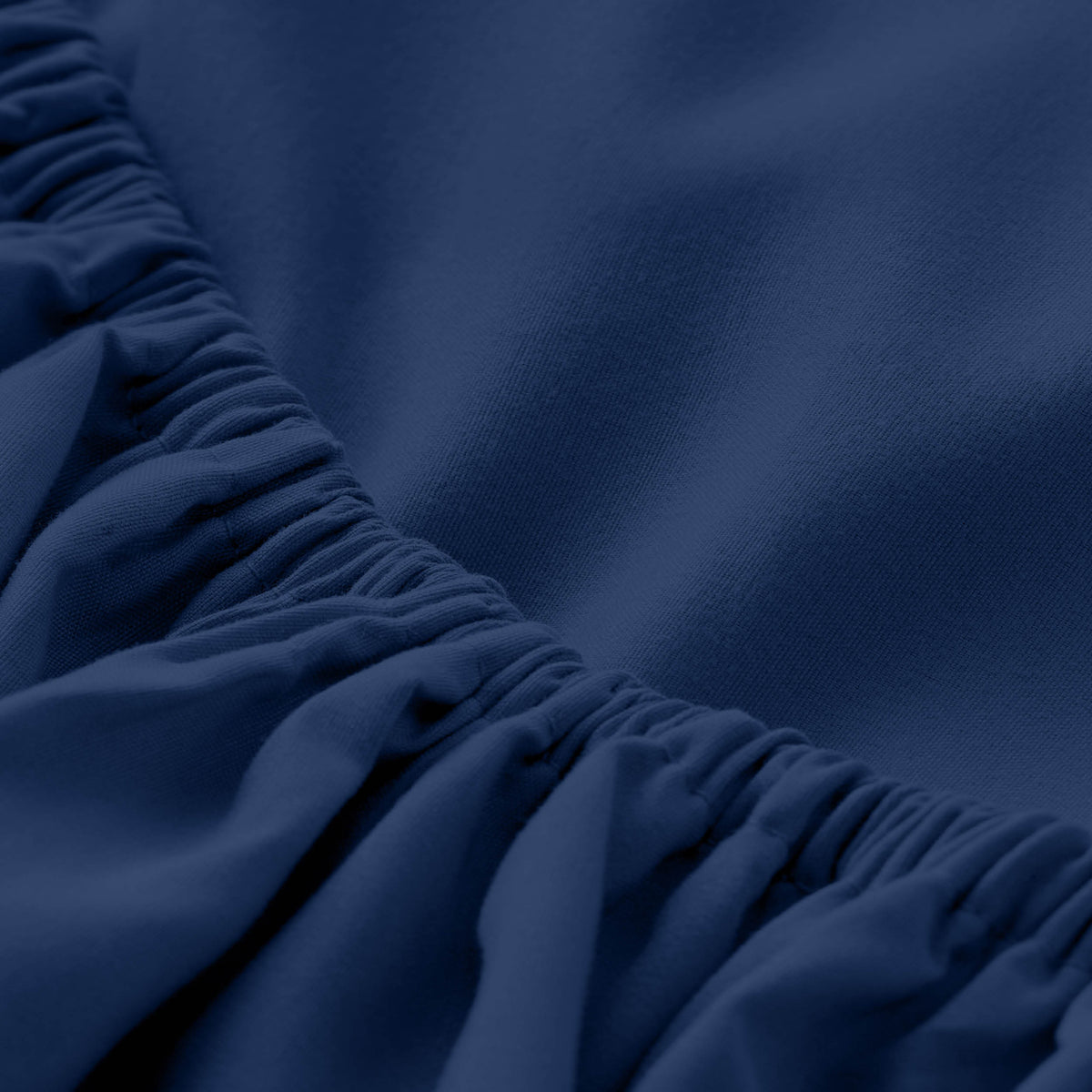 Close-up of fitted sheet with all around elastic