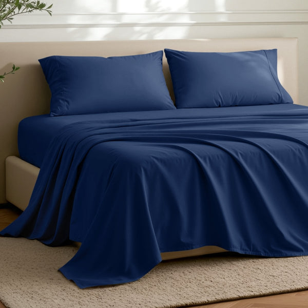 Microfiber flat sheet on a bed in a bedroom with a plant