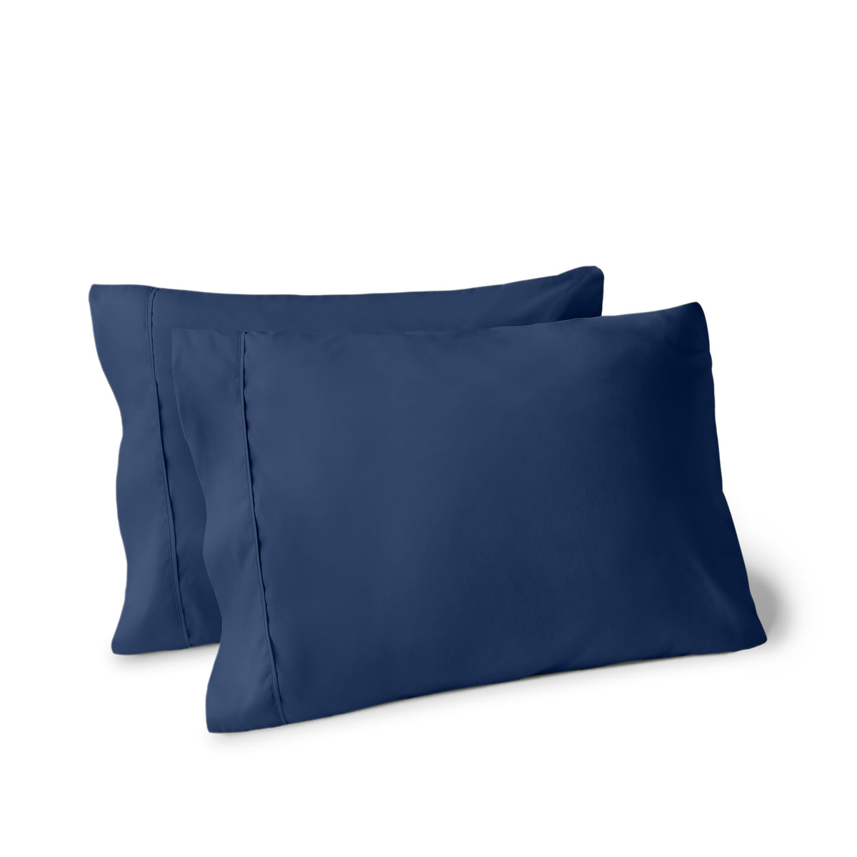 Two pillows on a white background with pillowcases on them
