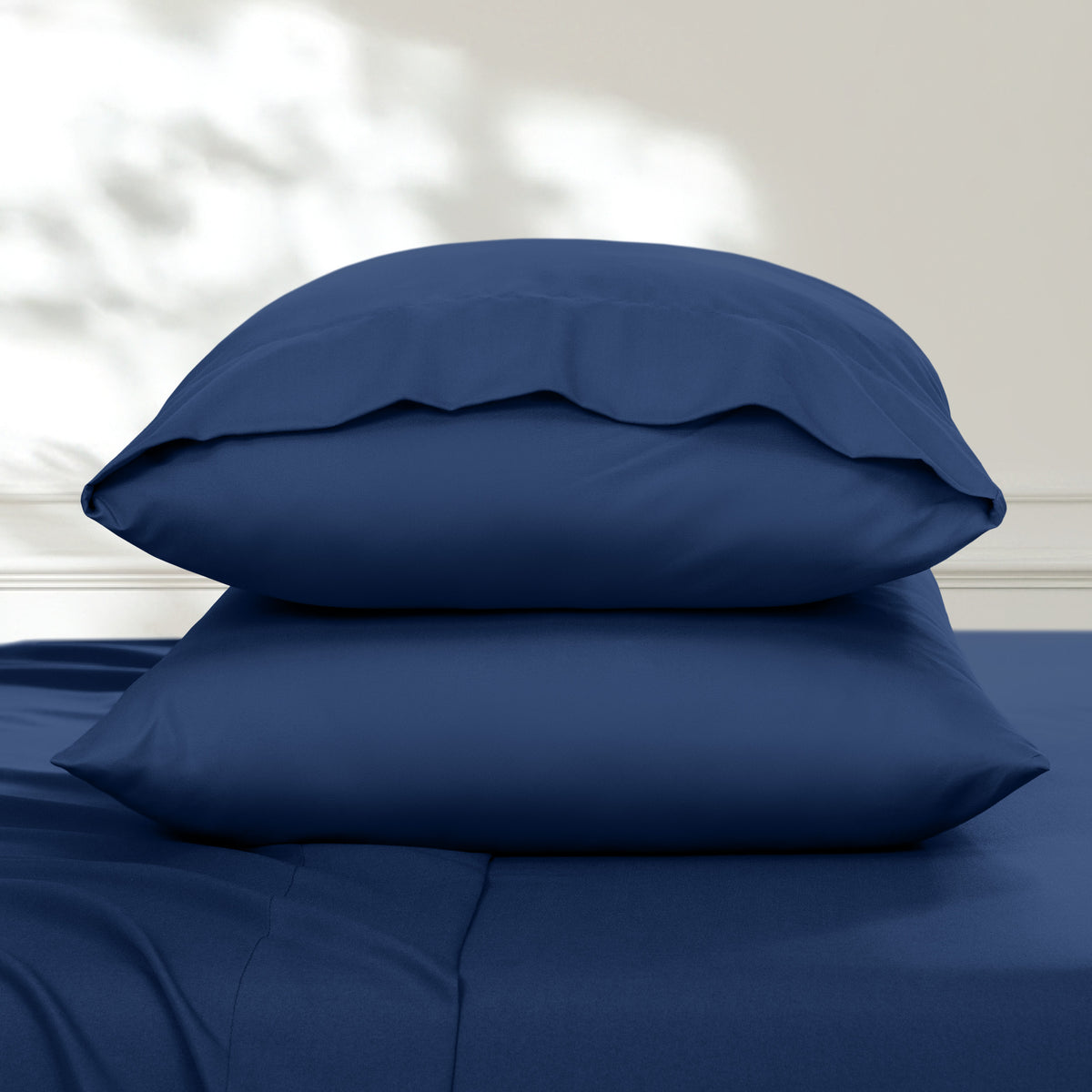 2 pillowcases on pillows