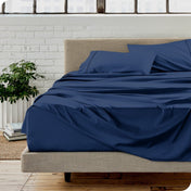A modern bedroom with microfiber sheets on the mattress