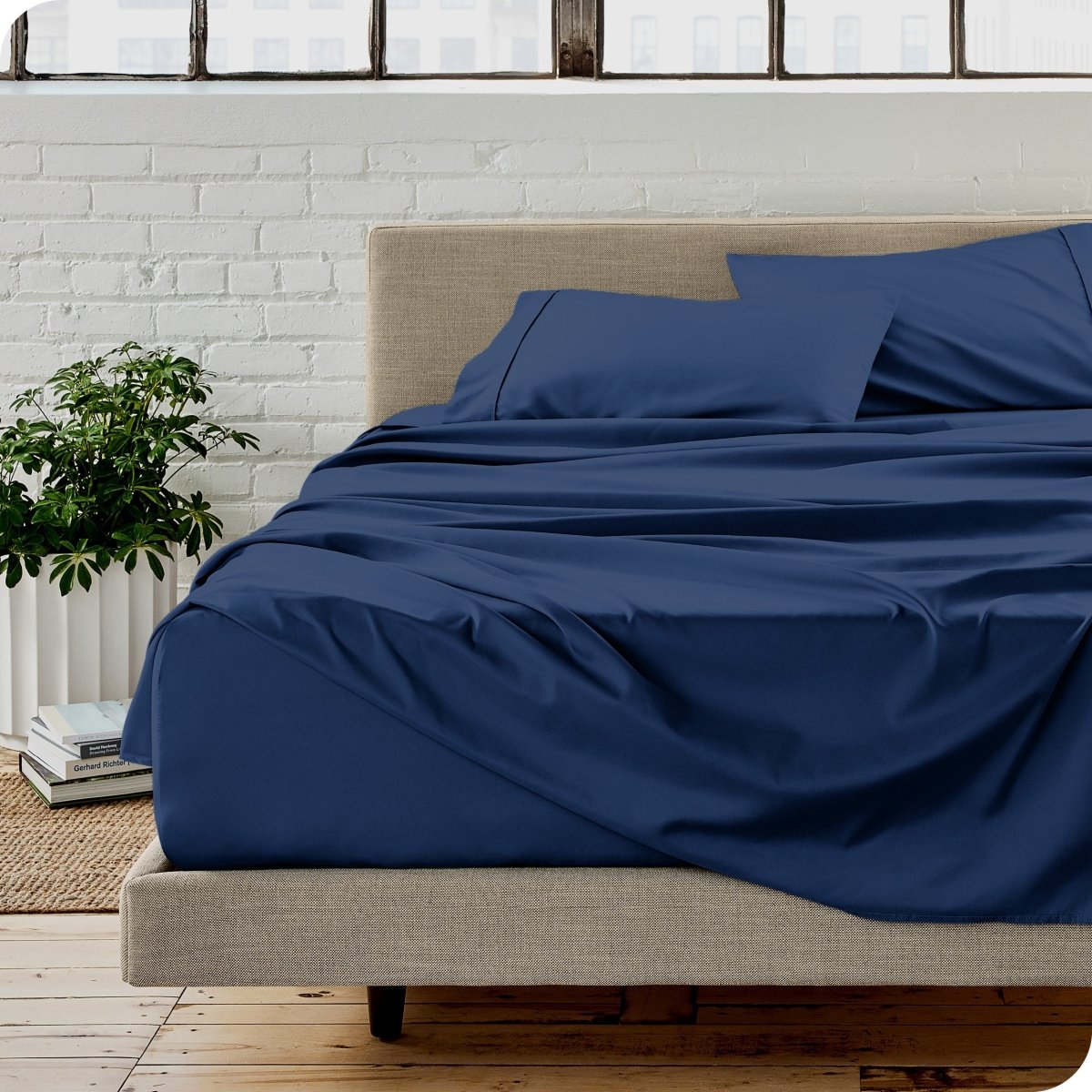 A modern bedroom with microfiber sheets on the mattress
