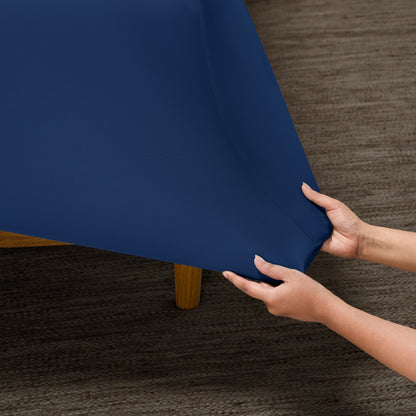 Person putting a microfiber stretch fitted sheet on a mattress