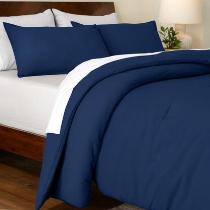 Track stitch comforter on a bed with white pillows and a wooden headboard.