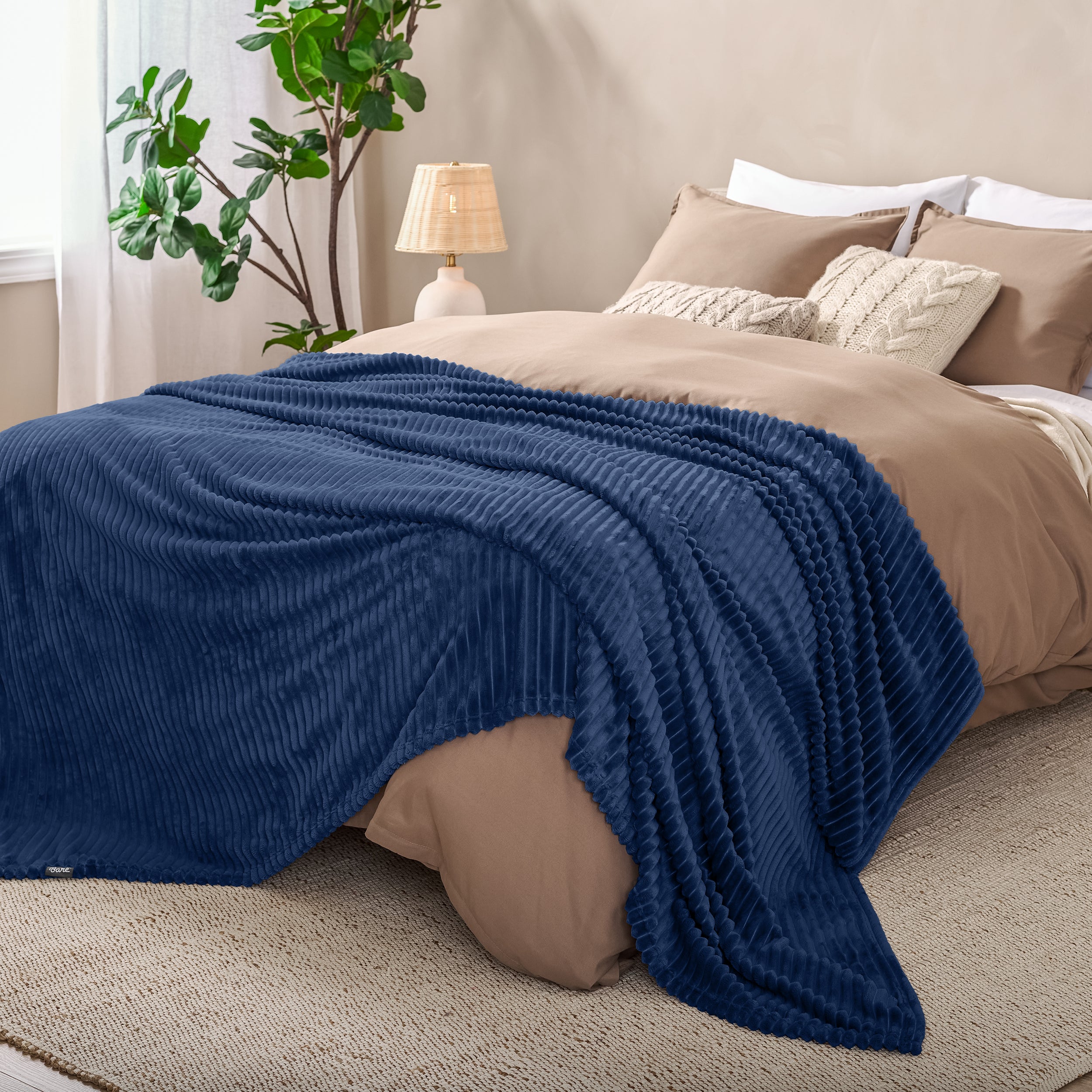 Microplush ribbed blanket on a bed