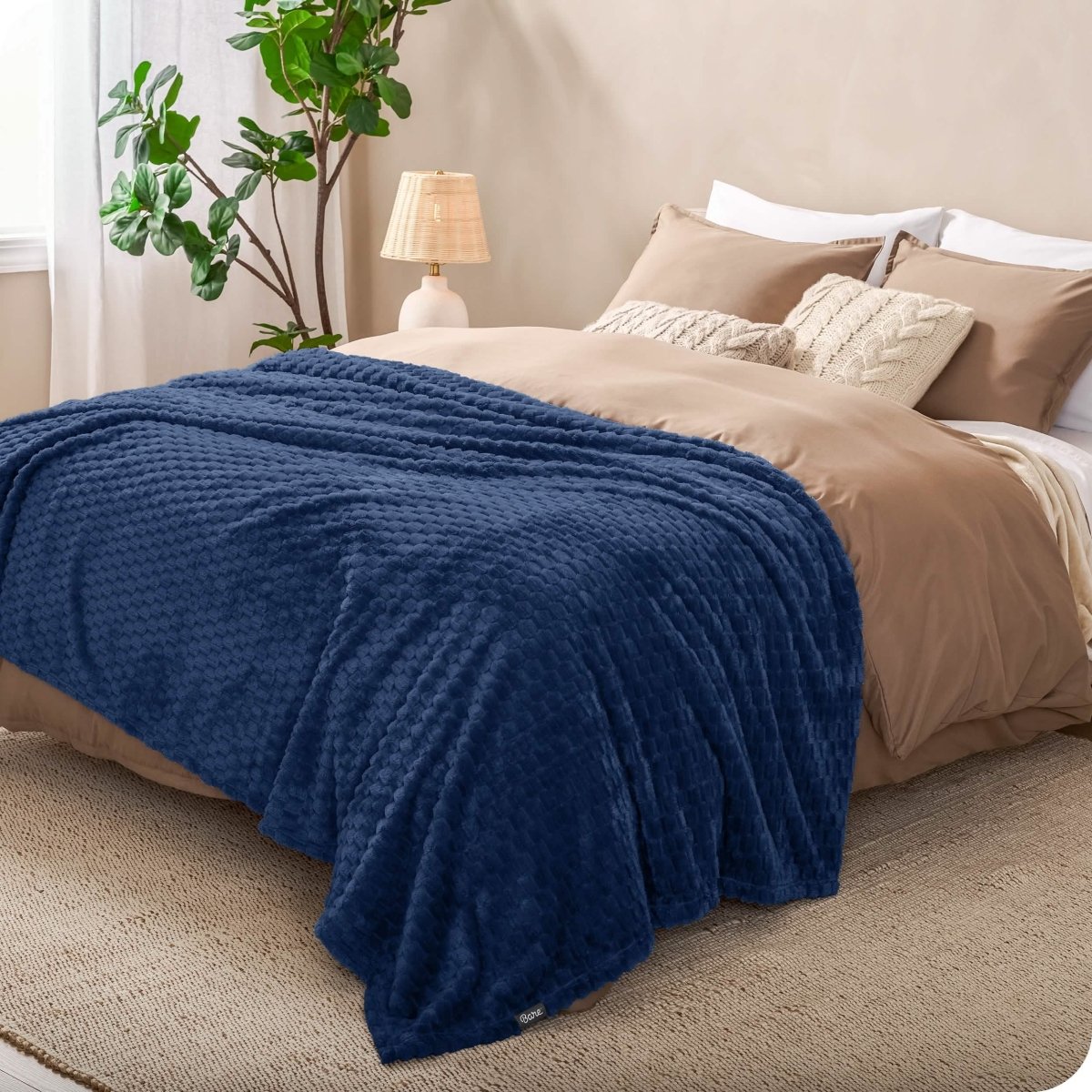 Microplush waffle blanket on a bed