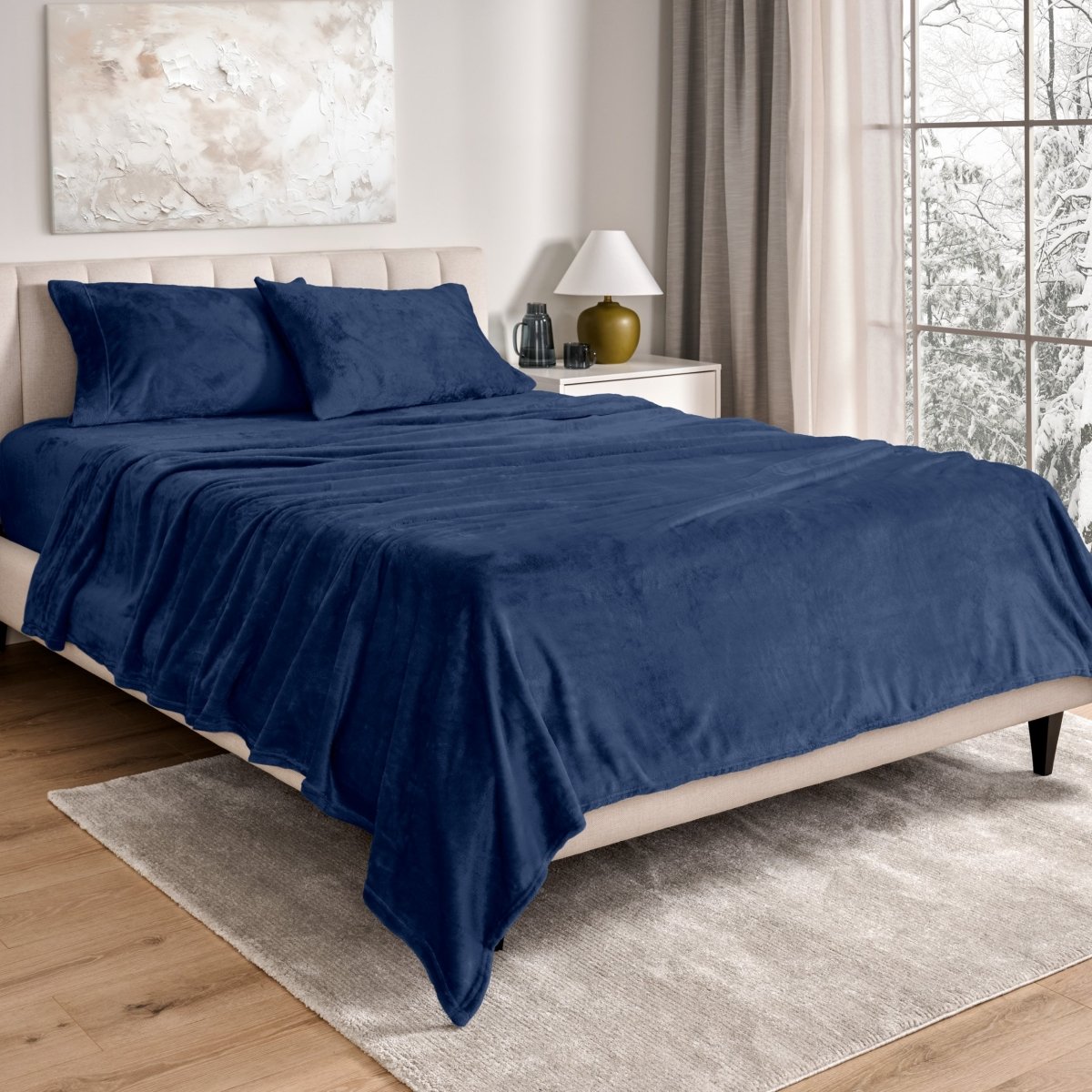 Neatly made bed in a well-lit bedroom.