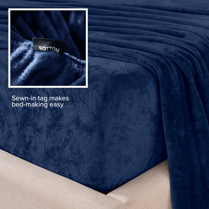 Close-up of the corner of a bed made with microplush sheets