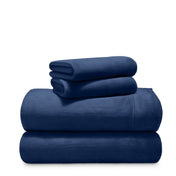 Stack of microplush sheets on a white background