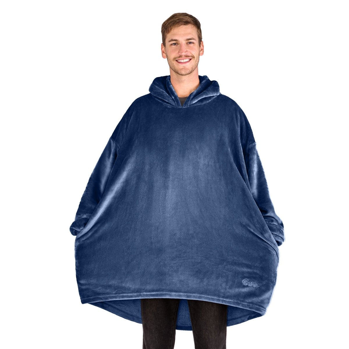 A man standing with a wearable blanket on