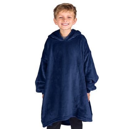 A boy wearing a blanket made of microplush, showcasing comfort and warmth.
