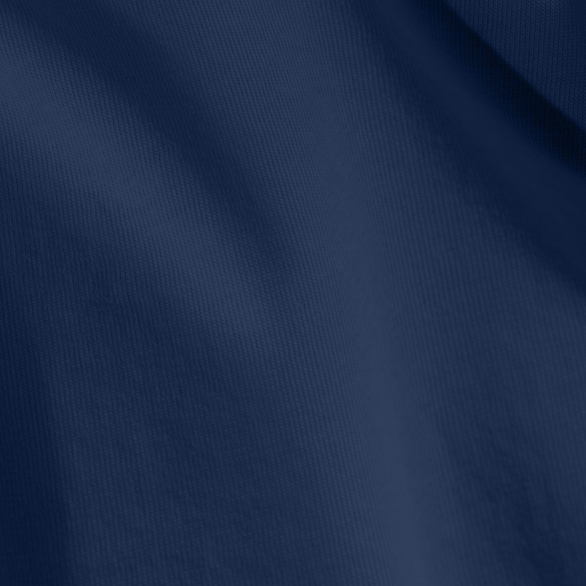 Close-up of organic cotton jersey fabric with subtle texture
