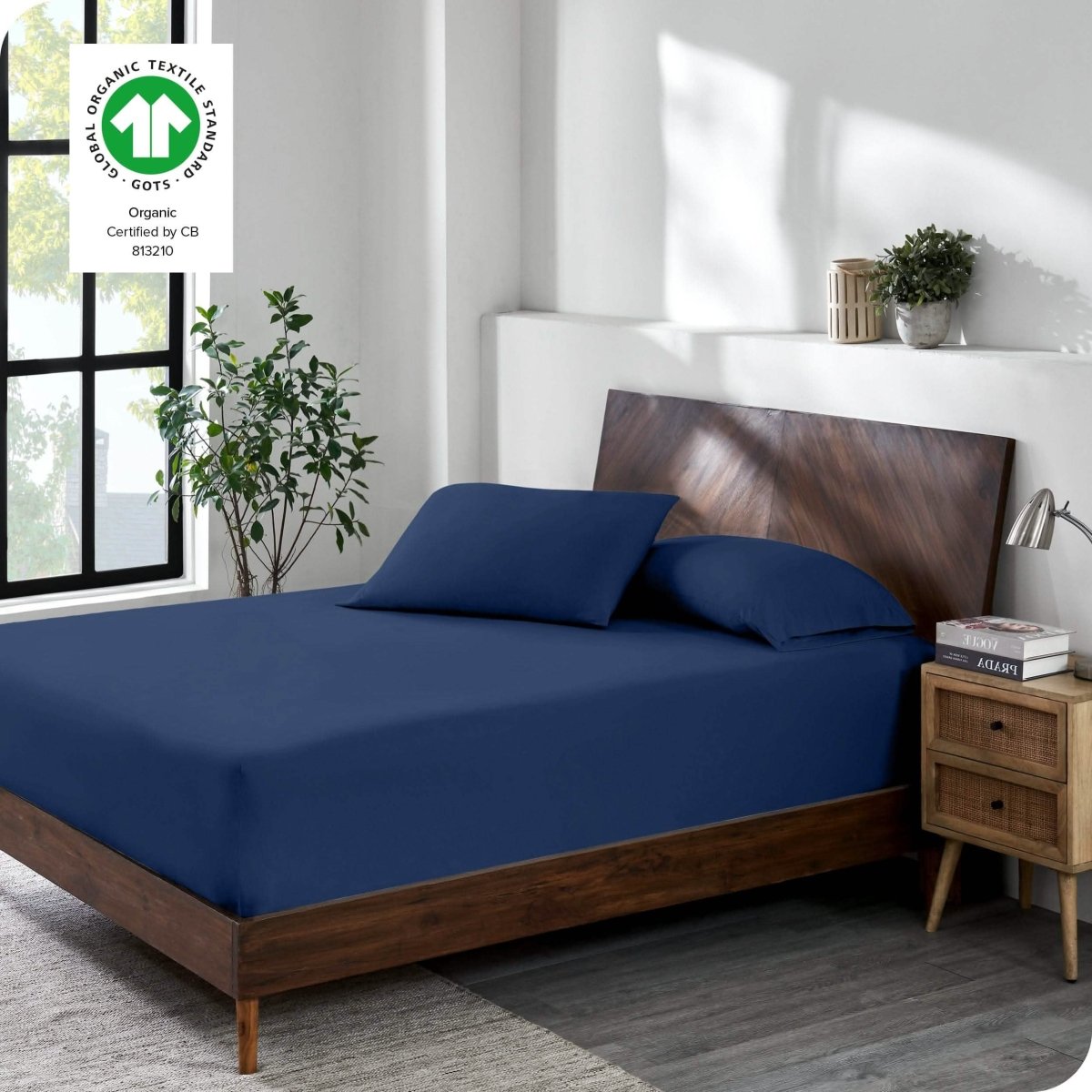 A modern bedroom with a jersey fitted sheet on the mattress with matching pillowcases