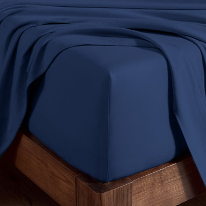 Organic cotton jersey sheet set on a wooden bed frame