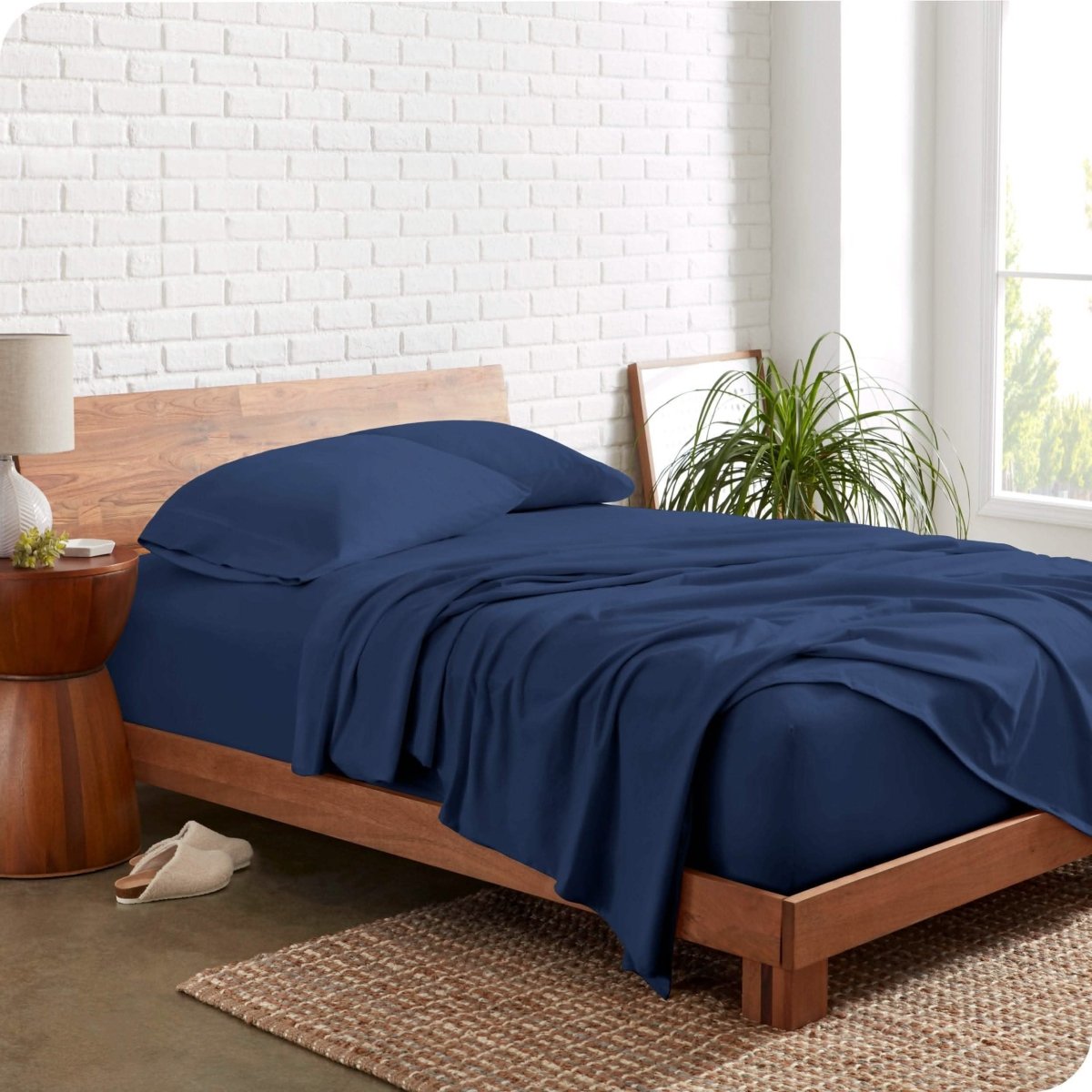 The side view of a bed made with organic cotton jersey sheets