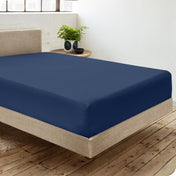 Diagonal view of room scene with percale fitted sheet on the bed