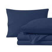 Percale sheets folded and matching pillowcases with pillows in them