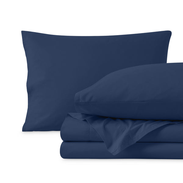 Percale sheets folded and matching pillowcases with pillows in them