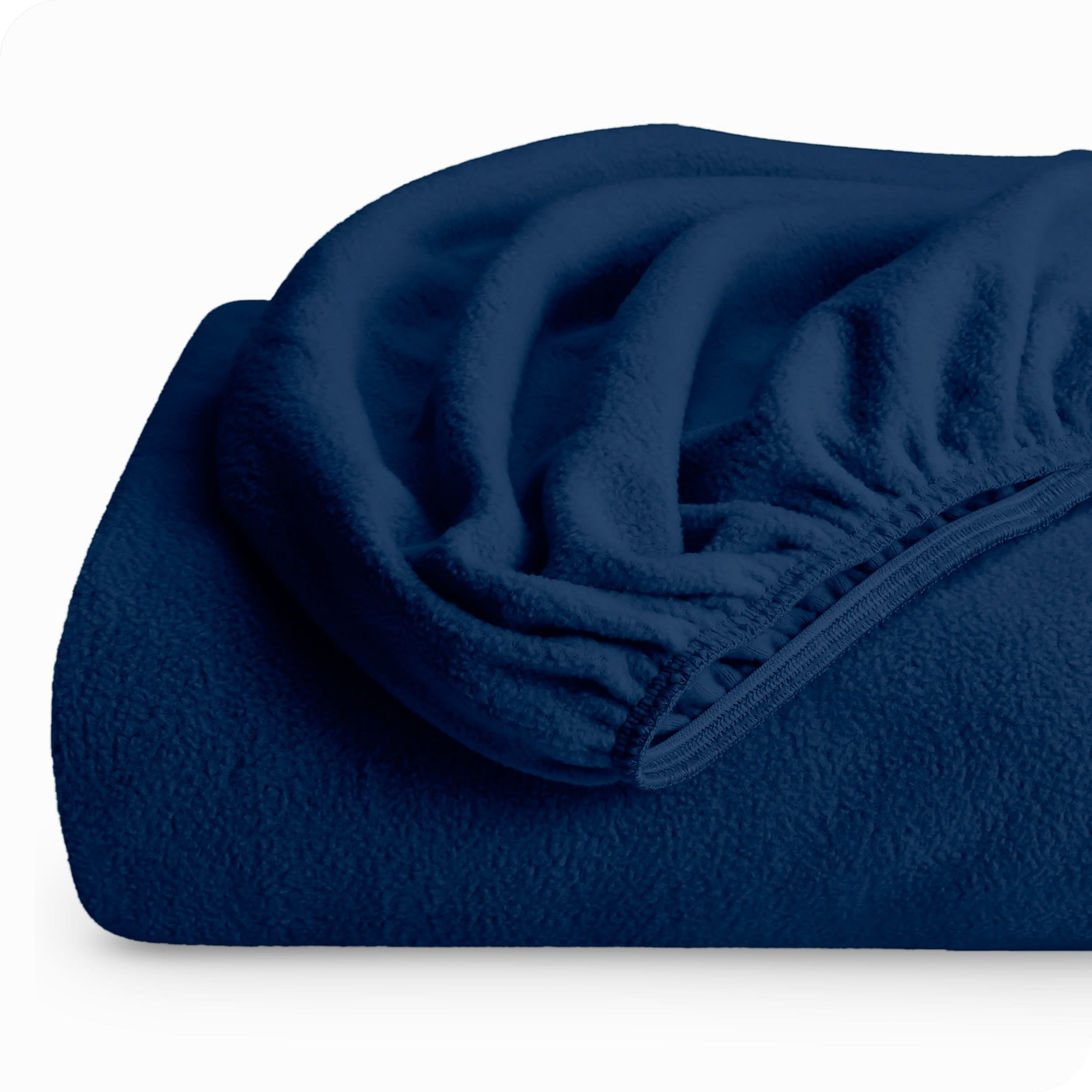 A folded polar fleece fitted sheet.