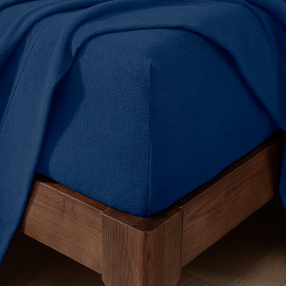Fitted sheet on a wooden bed frame