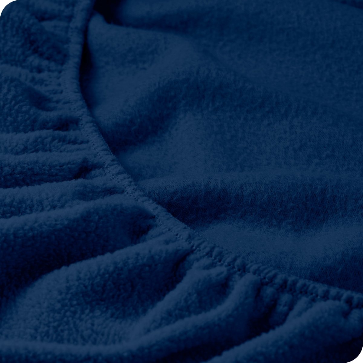 Close up of the elastic portion of a fleece fitted sheet