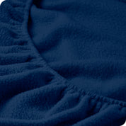 A close view of the elastic of a polar fleece fitted sheet.