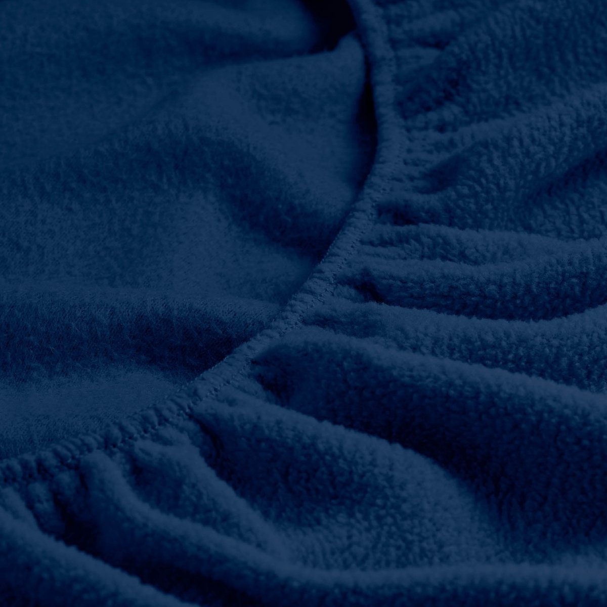 Close-up of a fitted sheet with all around elastic