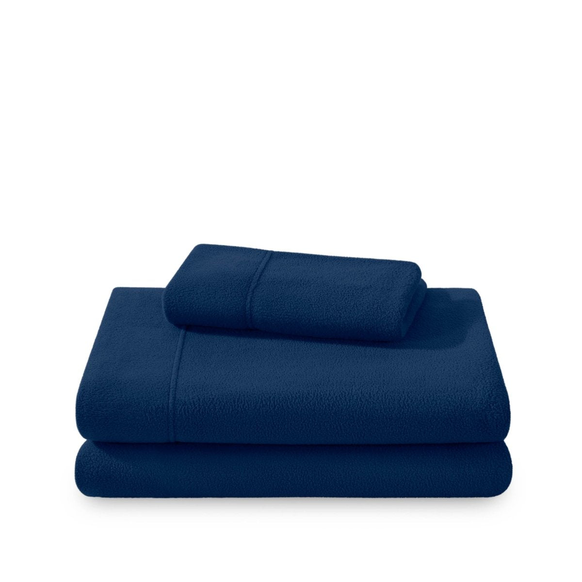 Polar fleece sheets and pillowcases folded and stacked on a white background