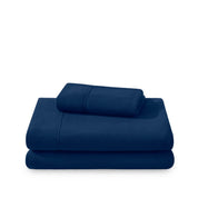 Polar fleece sheets and pillowcases folded and stacked on a white background