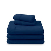 Polar fleece sheets and pillowcases folded and stacked on a white background