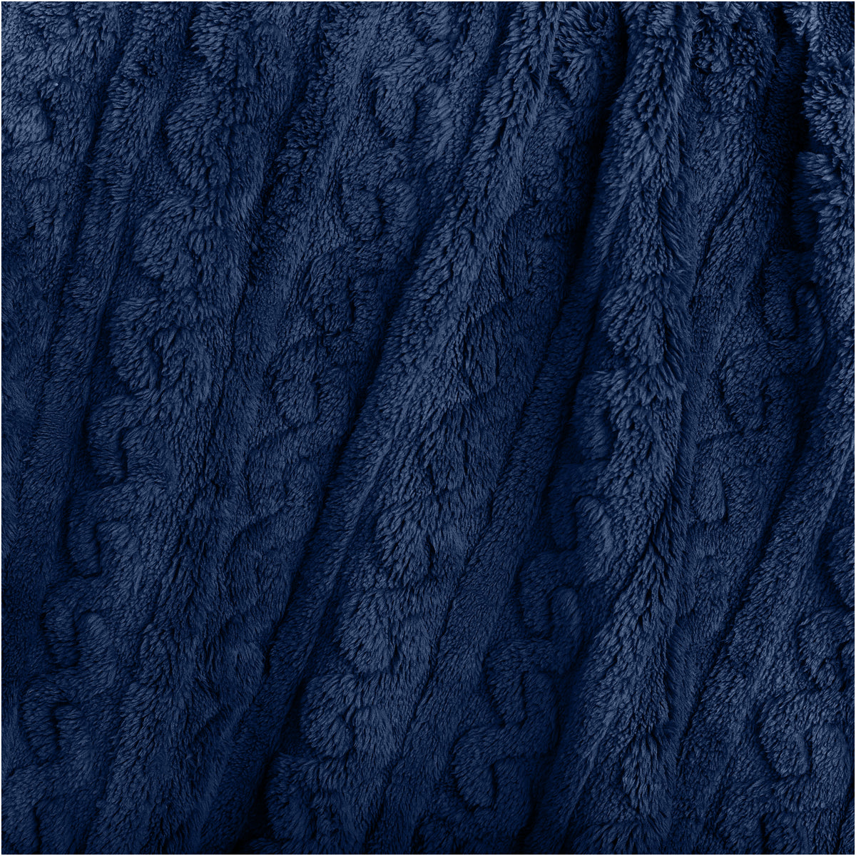 Close-up of a textured blanket with a cable knit pattern