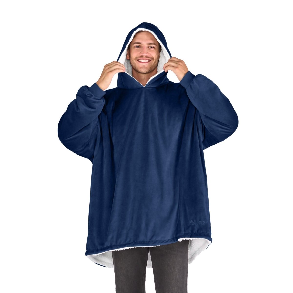 An adult with a sherpa wearable blanket on