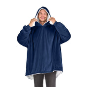 An adult with a sherpa wearable blanket on
