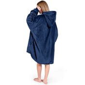 An adult with a sherpa wearable blanket on