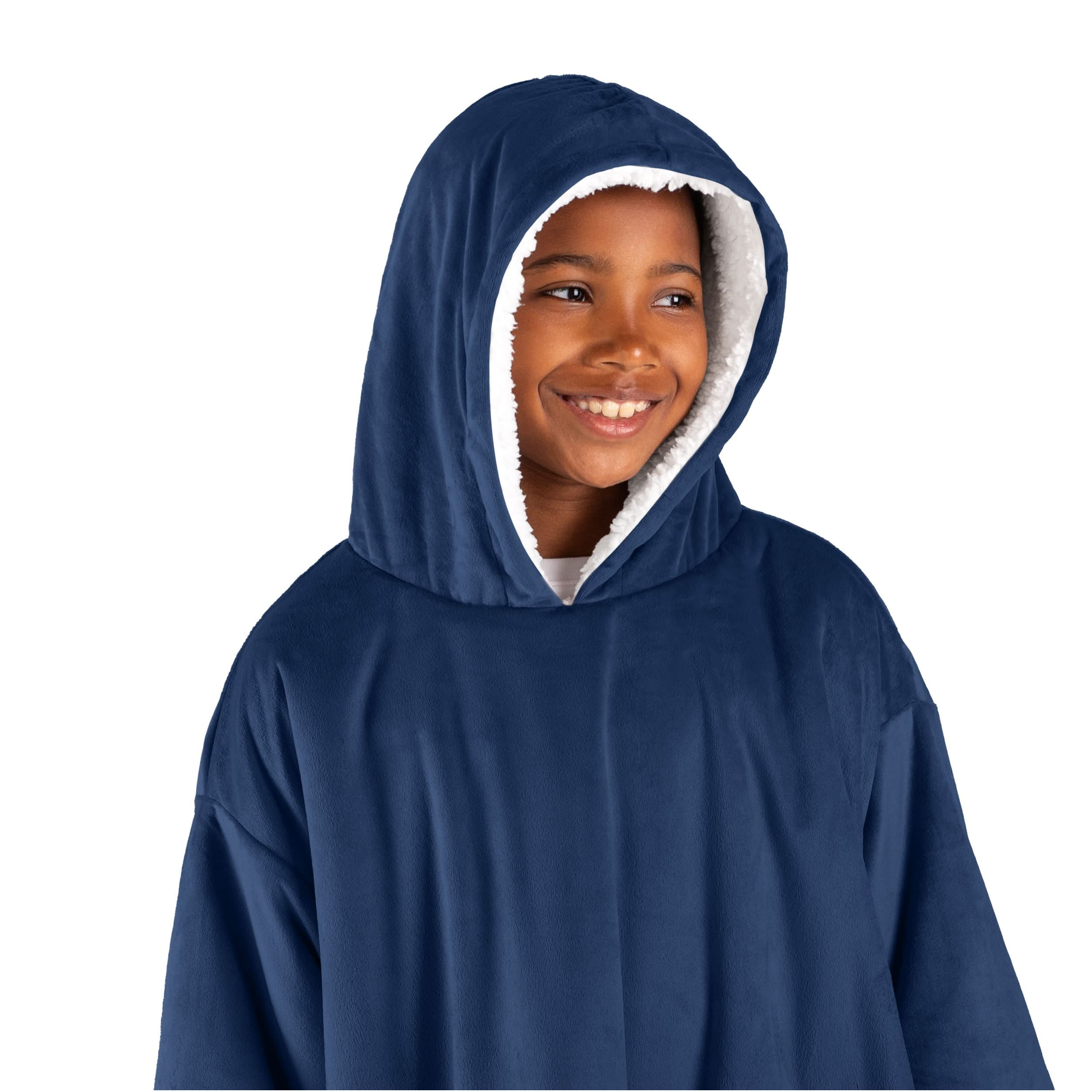 A boy has a wearable blanket on