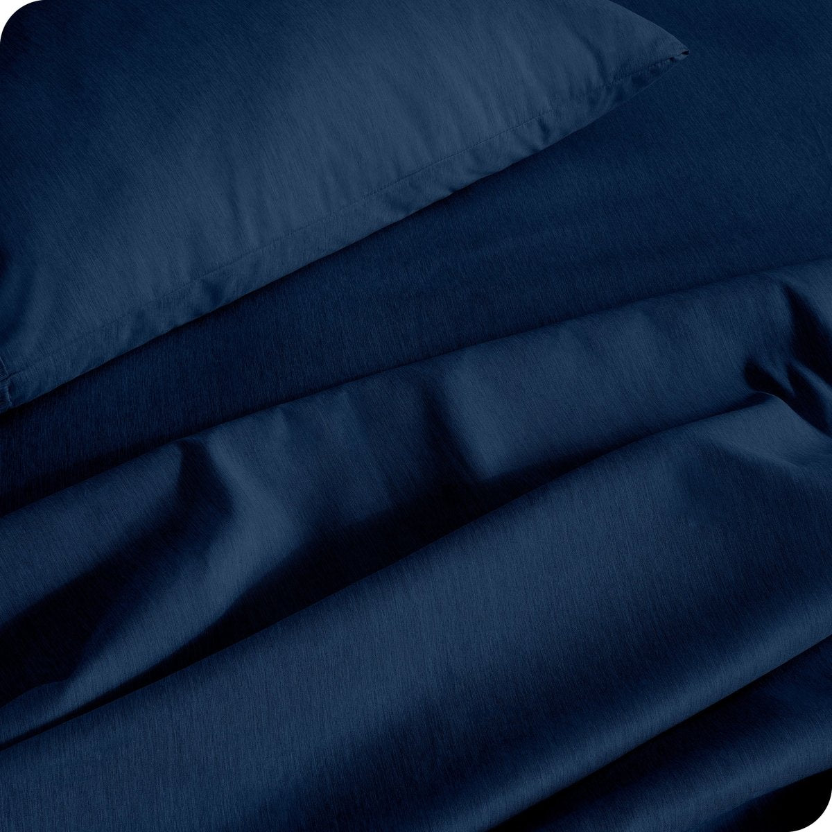 Close up of a heather sheet set on a bed