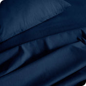 Close up of a heather sheet set on a bed