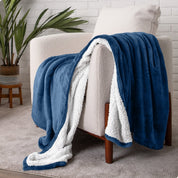 Blanket draped over a chair in a cozy living room setting.