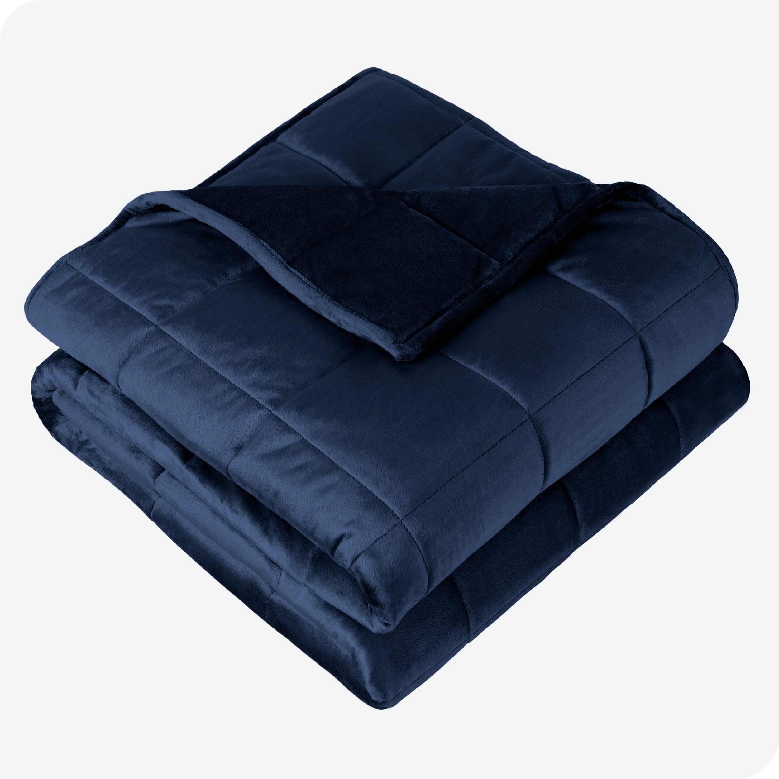 A minky weighted blanket folded neatly on a white background.