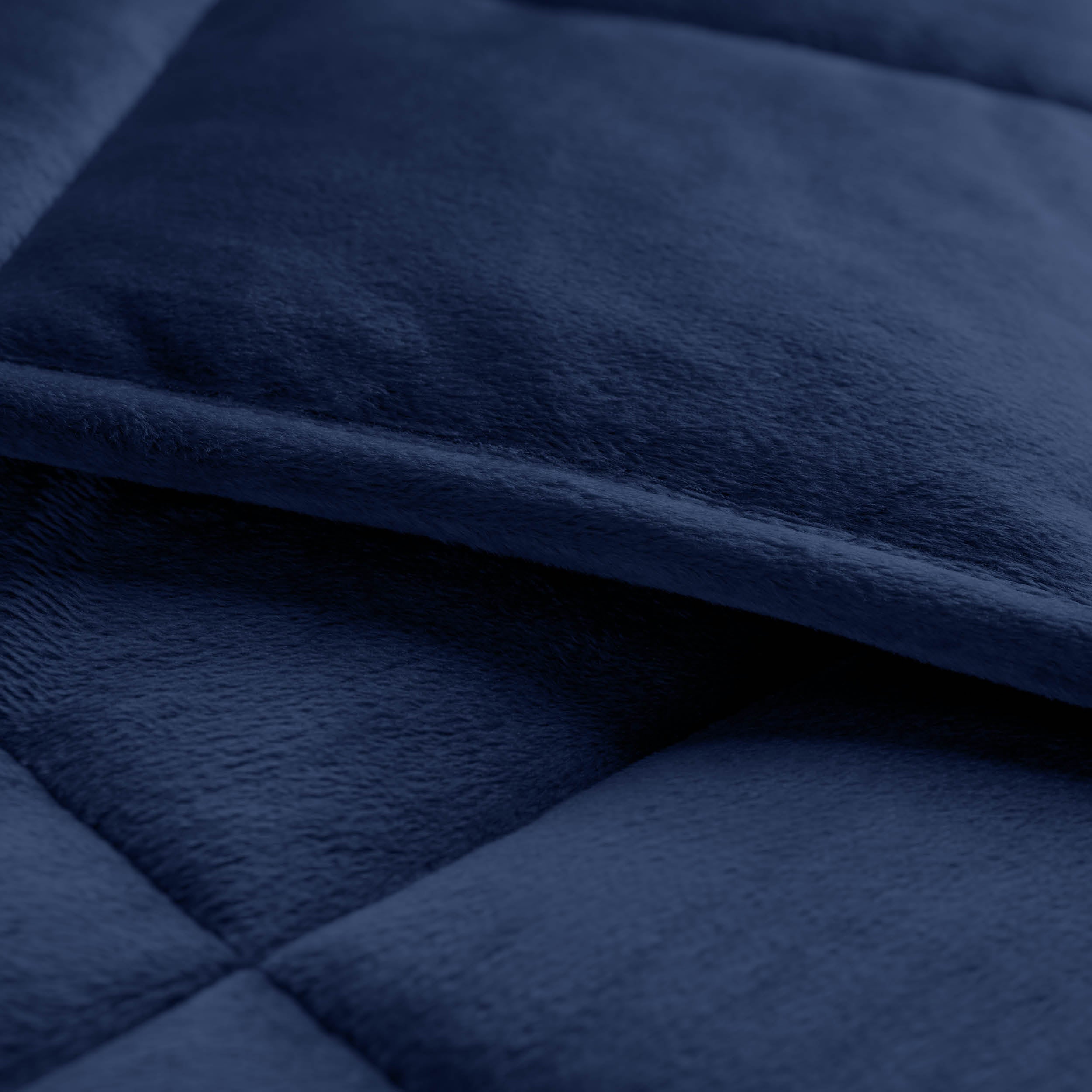 Close-up of a weighted blanket showing the stitching and texture