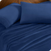 A sheet set and matching pillowcases on a bed.