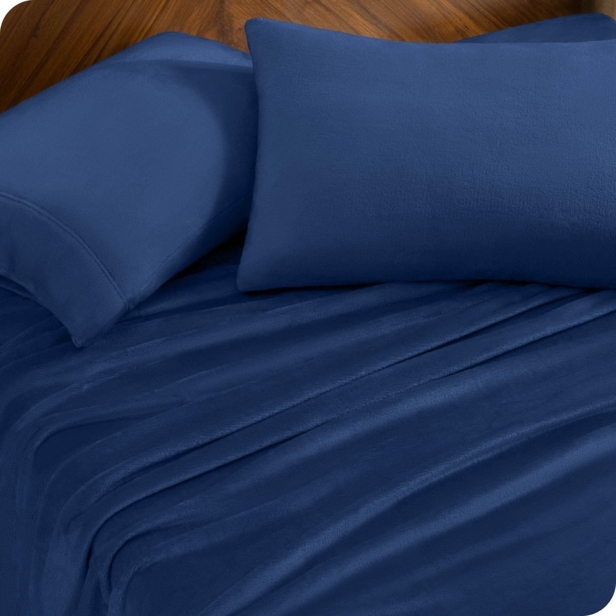 A sheet set and matching pillowcases on a bed.
