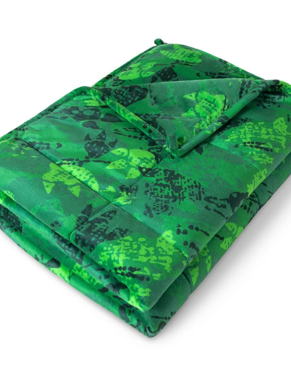 A minky weighted blanket folded neatly on a white background.