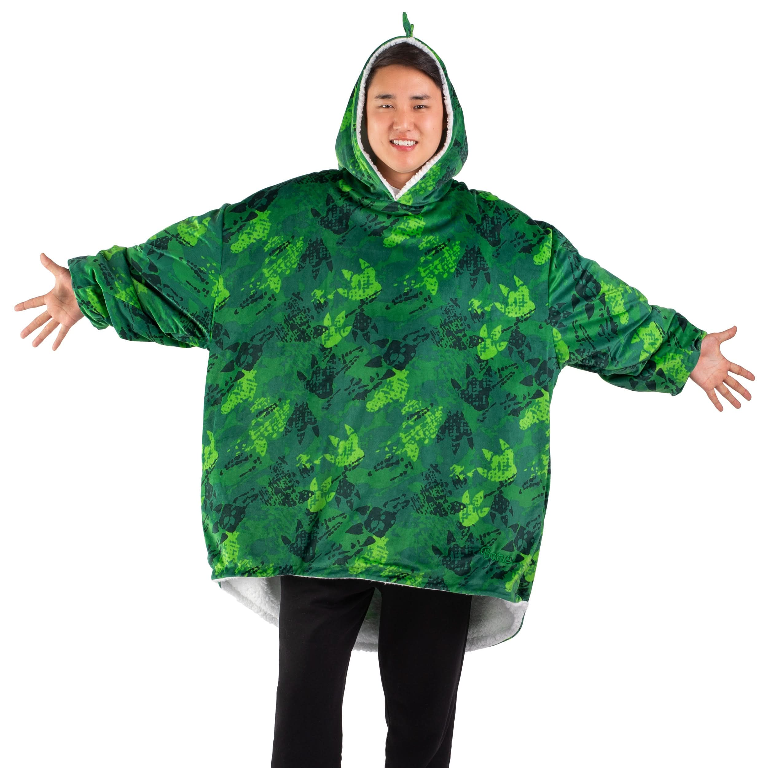 An adult with a wearable blanket on