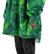 An adult with a sherpa wearable blanket on