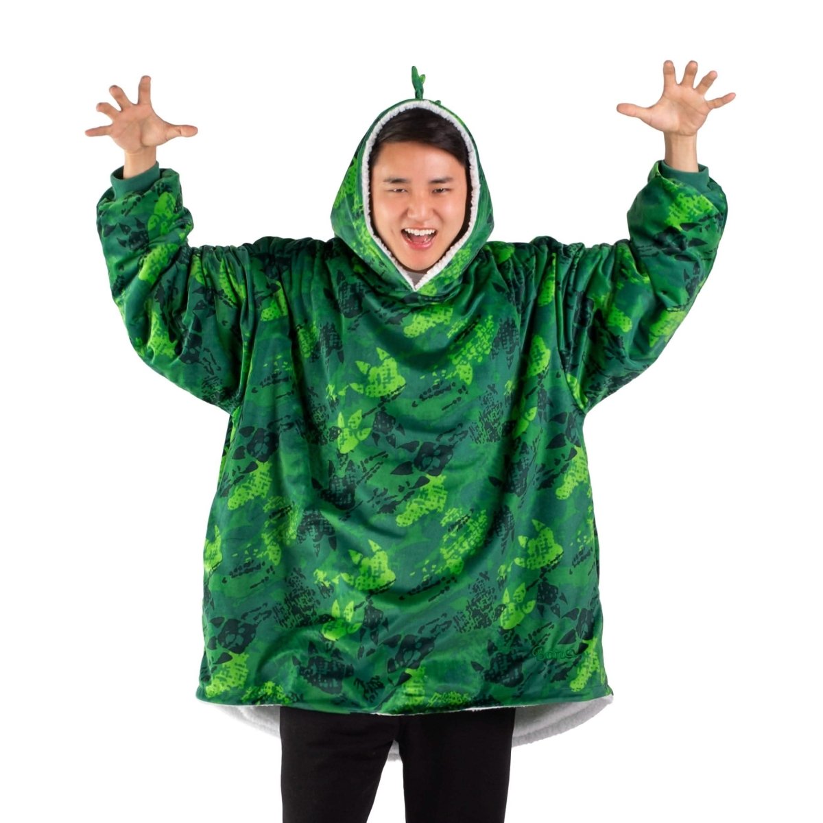 An adult with a sherpa wearable blanket on