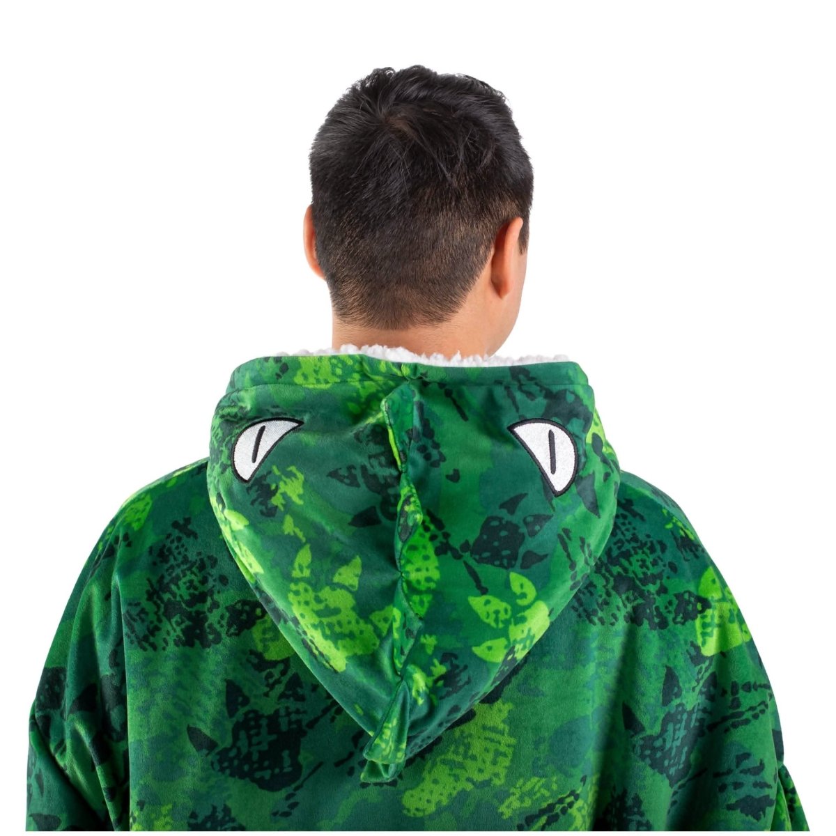 An adult with a sherpa wearable blanket on