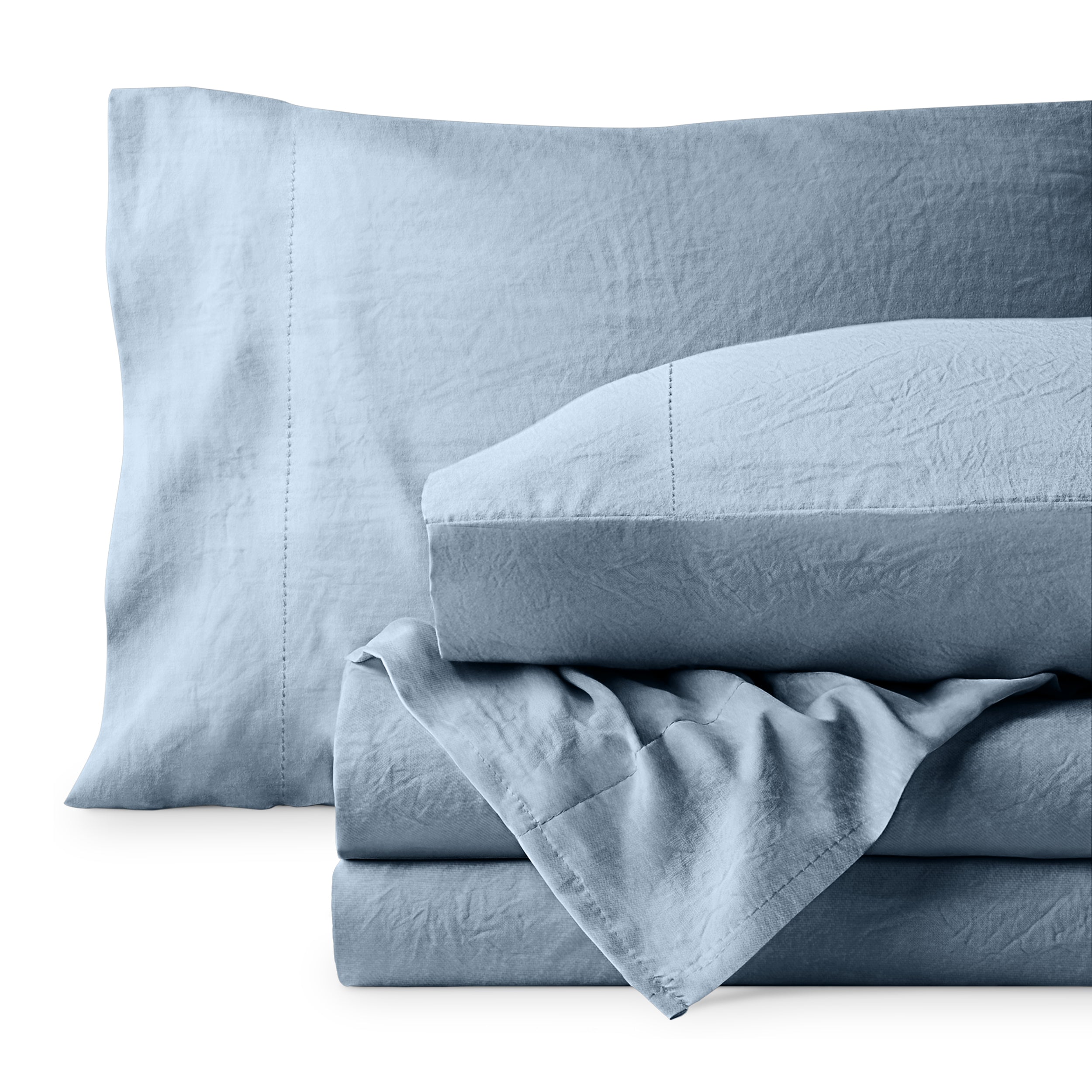 Washed microfiber sheet set folded and stacked on a white background