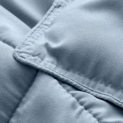 Close-up of comforter fabric with stitching detail