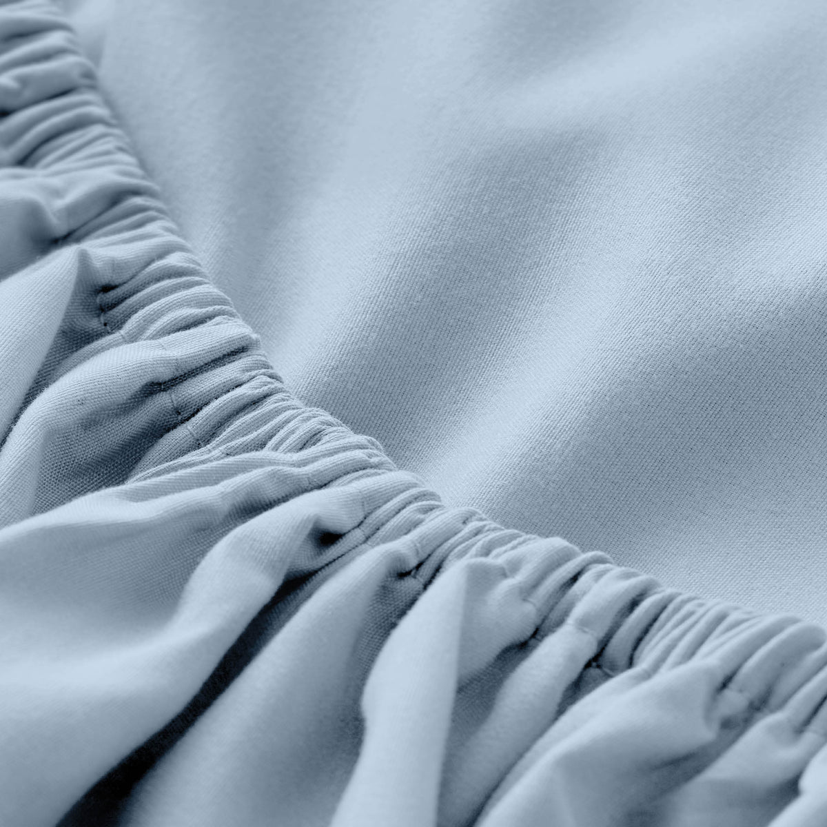 Close-up of fitted sheet with all around elastic
